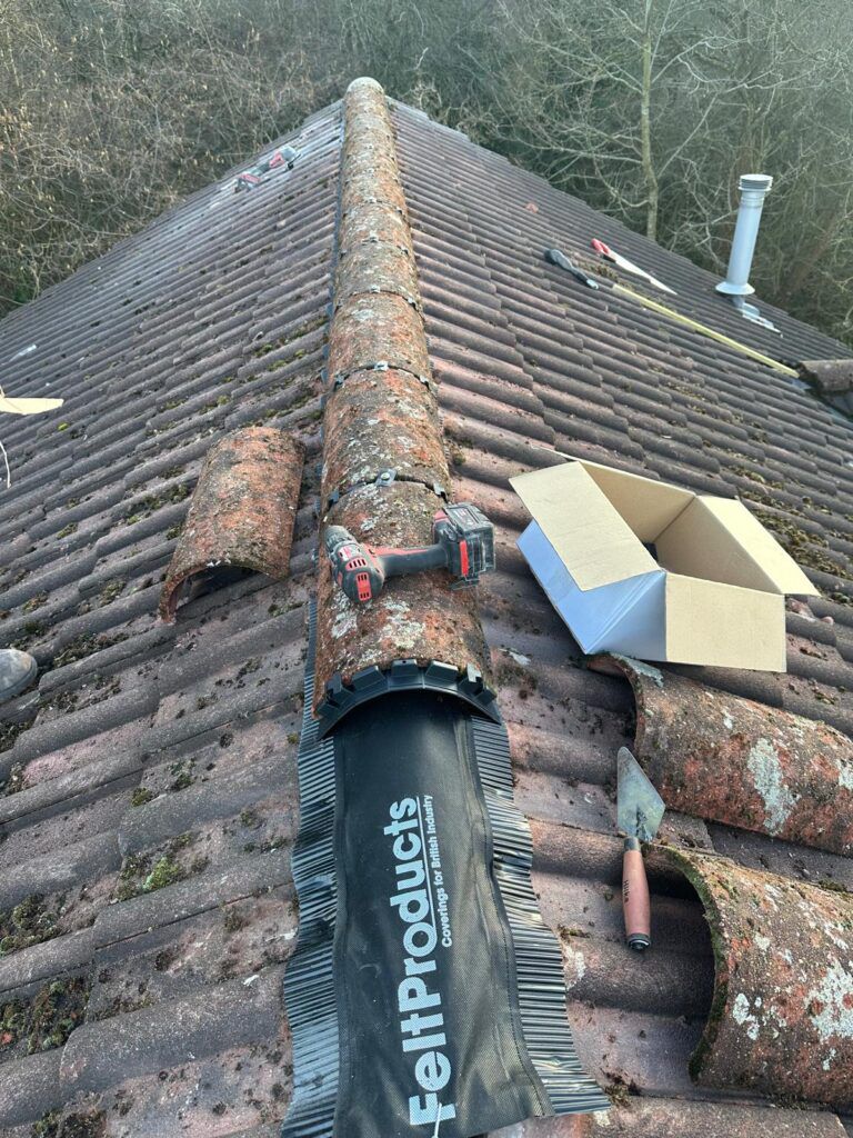 HomeShield roofer carrying out a leak repair on a tiled roof